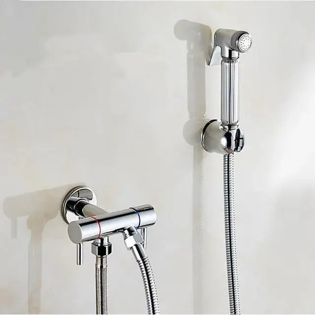 Chrome-finished handheld showerhead with sleek cylindrical design and flexible hose for decorbites brass bidet shattaf use