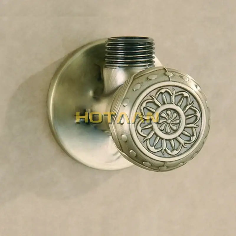 Antique engraved brass triangle valve bathroom faucet with ornate floral engraving and threaded spout in brass finish