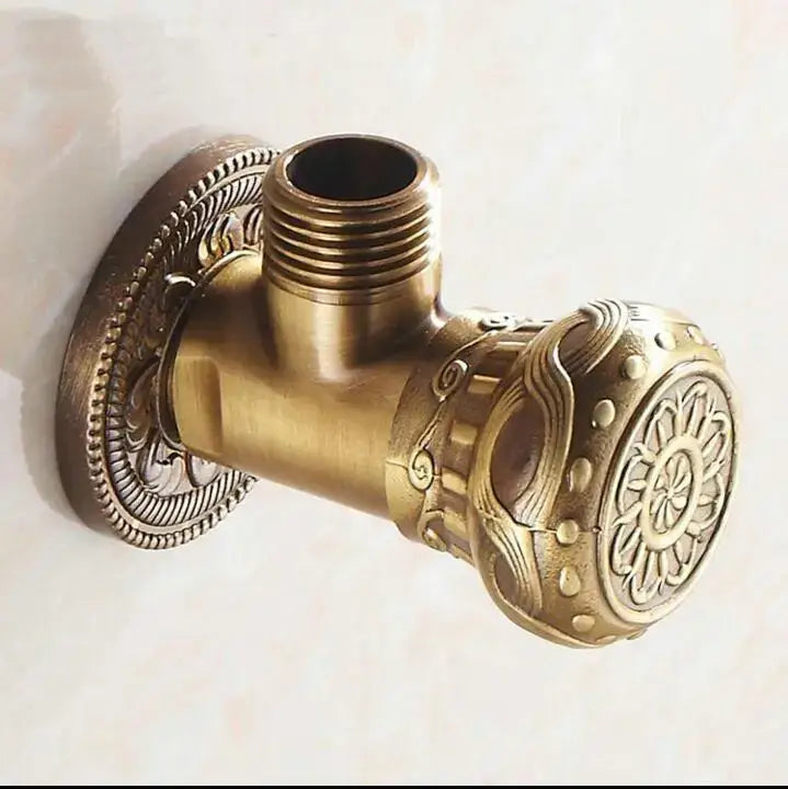 Antique floral brass bathroom angle stop valve with intricate scrollwork embossing and brass finish stop valve design