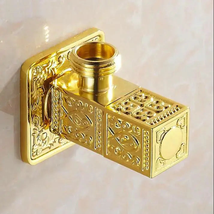 Antique floral brass bathroom angle stop valve in gold with ornately engraved intricate patterns on brass material