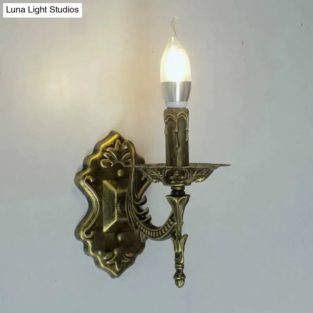 Antique gold retro european wall light antique brass candlestick sconce with ornate scrollwork and frosted glass bulb
