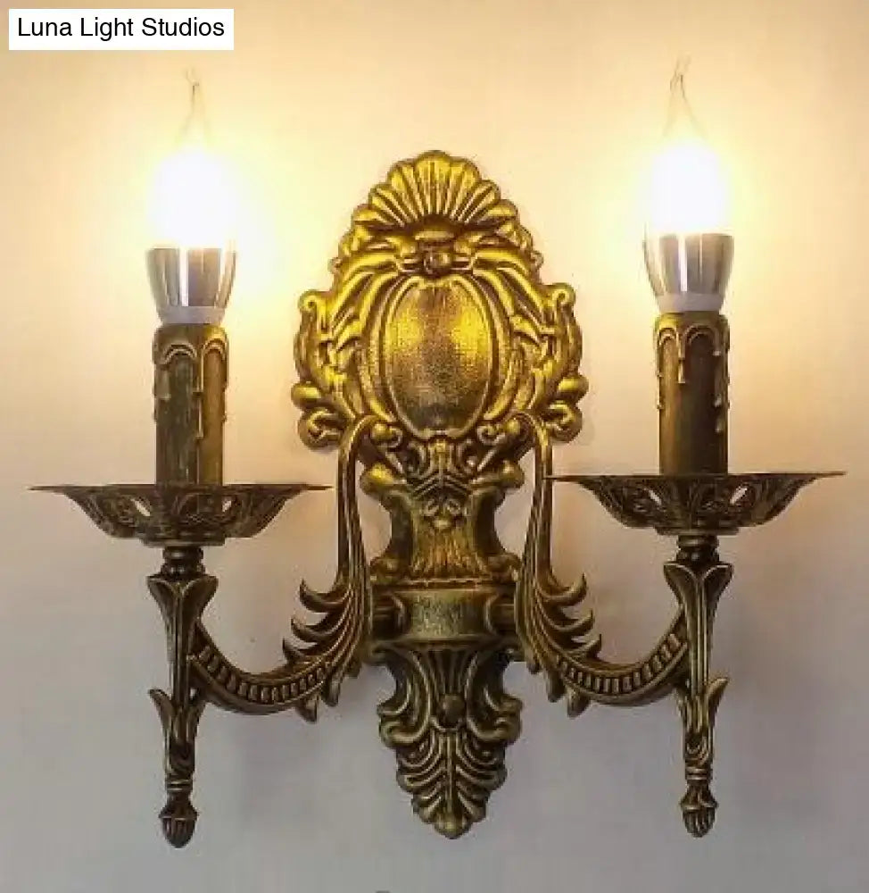 Antique gold retro european wall light featuring ornate baroque-style metal sconce with two candle-shaped bulbs