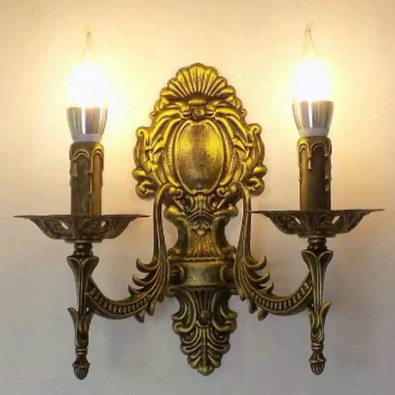 Antique gold retro european wall light with ornate gold-finished two-bulb candle sconce for bedroom use