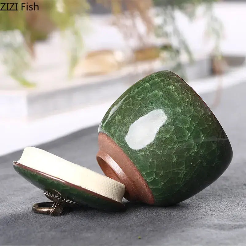 Antique green ceramic tea caddy with ice cracked texture and copper-toned rim for kitchen storage use