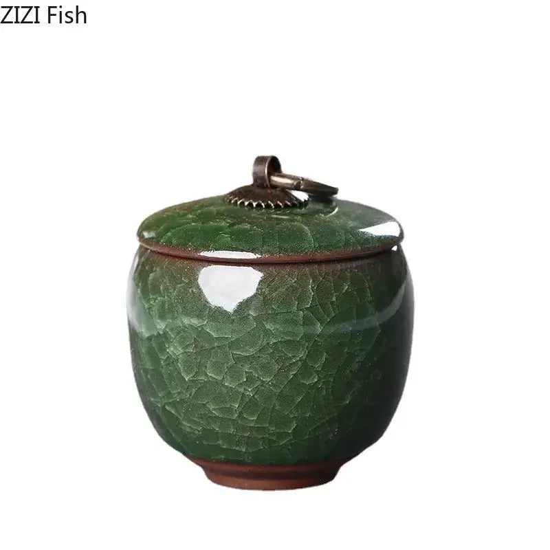 Antique green ceramic tea caddy with ice cracked texture glaze and bronze metal lid for kitchen storage