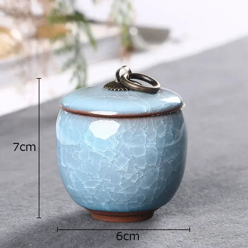 Antique green tea caddy ceramic jar with ice cracked texture and brass ring handle for kitchen storage
