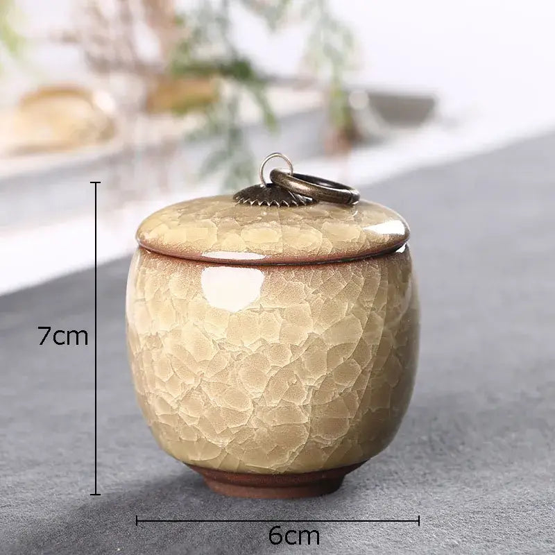 Antique green ceramic tea caddy with ice cracked texture glaze and ornate metal ring lid for kitchen storage