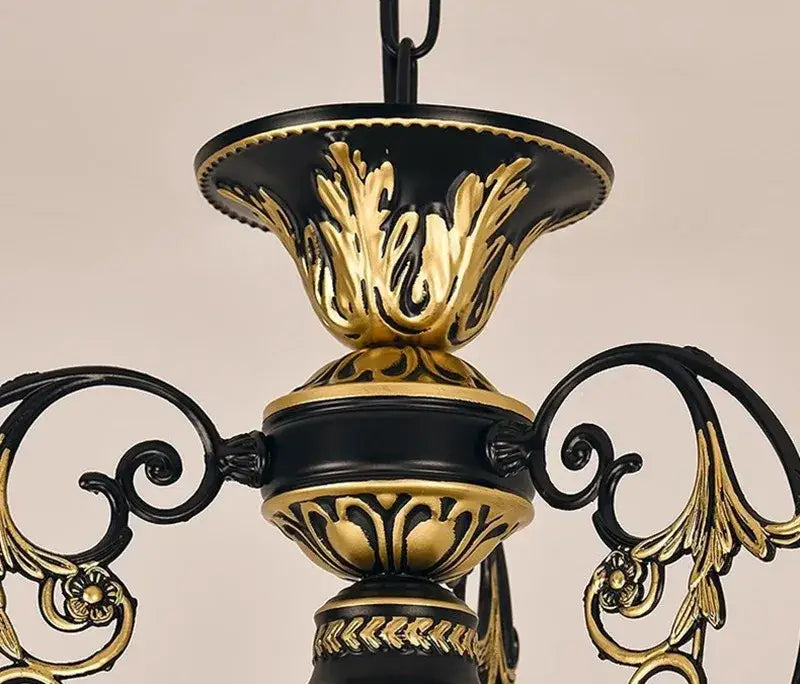 Black and gold ornate antique industrial loft chandelier with intricate scrollwork for dining room decorbites industrial loft