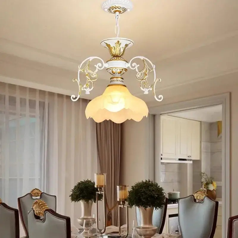 Antique industrial black and gold loft chandelier with white and gold ornate design and frosted glass shade decorbites industrial loft