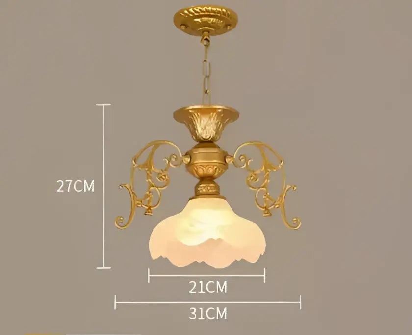 Gold-toned ornate chandelier with frosted glass shade for dining room featuring decorbites industrial loft style lighting