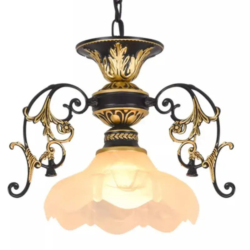 Antique industrial black and gold loft chandelier with ornate metalwork and warm frosted glass shade for dining room decorbites industrial loft