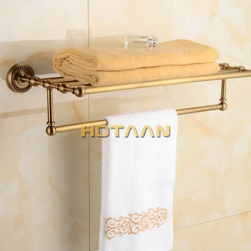 Antique ornate brass towel rack with double tier shelf and decorative wall-mounted bracket for bathroom decorbites brass towel rack