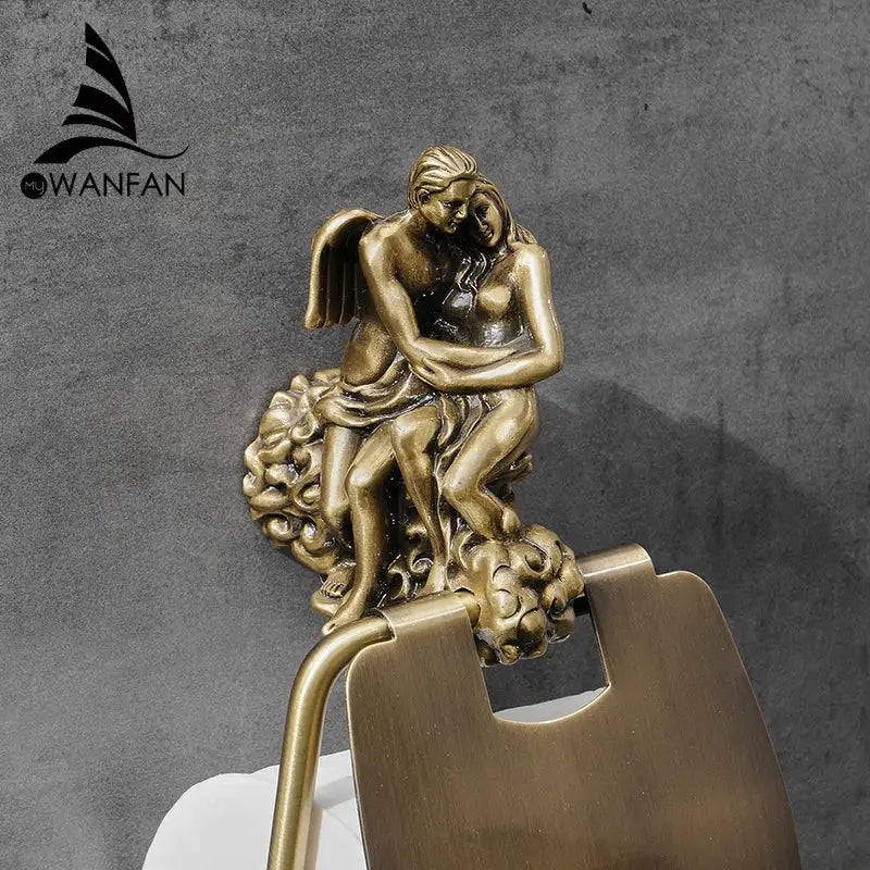 Antique ornate bronze toilet paper holder featuring a sculpted angel embracing a woman on a cloud base