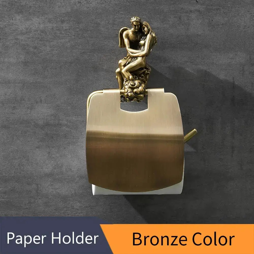 Antique ornate bronze toilet paper holder featuring a sculpted couple embracing as decorative bathroom paper holder