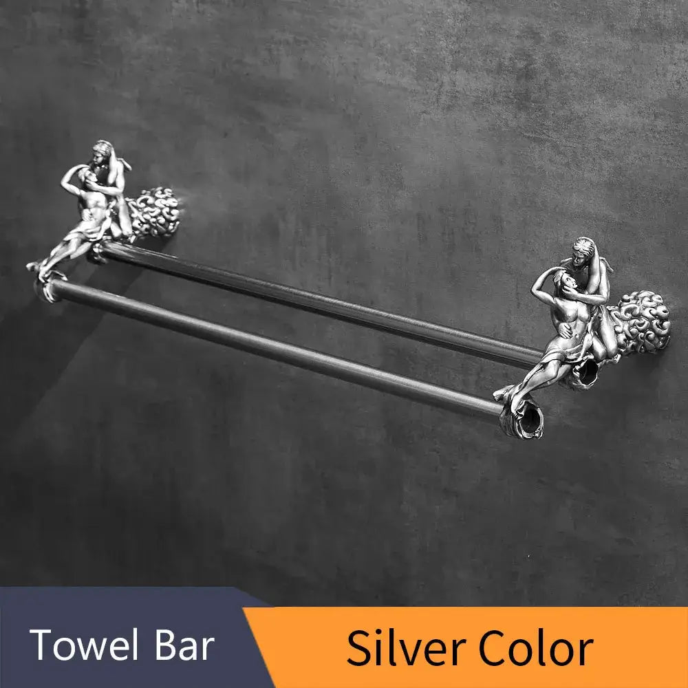 Silver-colored metal double towel bars with ornate sculpted figures at each end for bathroom use