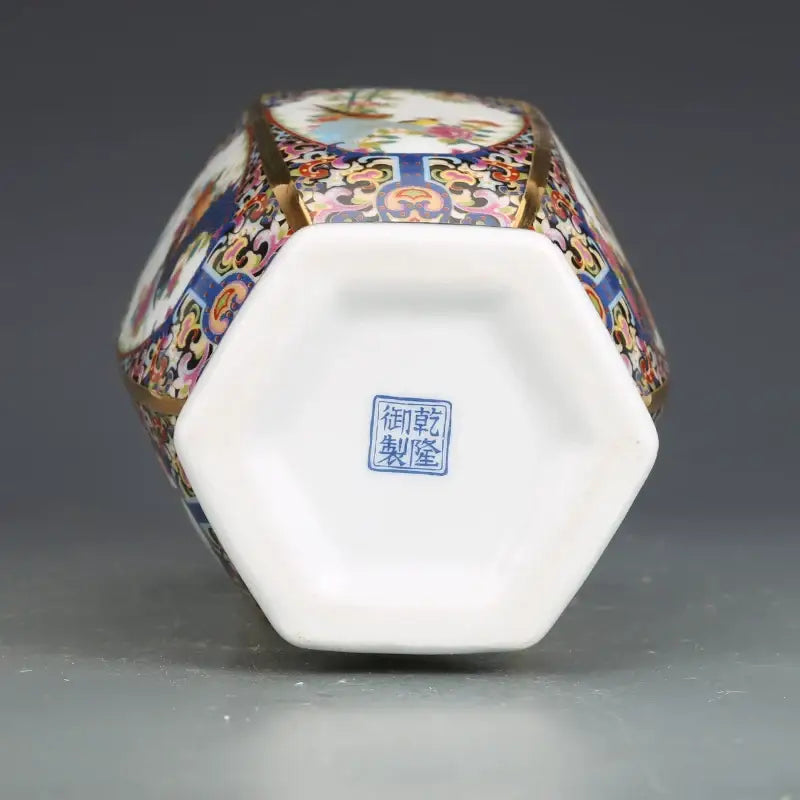 Hexagonal porcelain vase from antique porcelain vase collection with colorful enamel paintings and gold trim