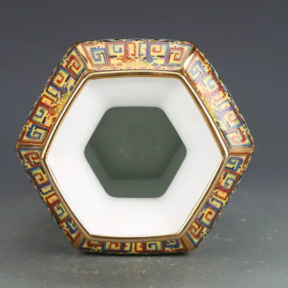 Hexagonal porcelain vase with intricate multicolored enamel patterns and gold trim from porcelain vase collection