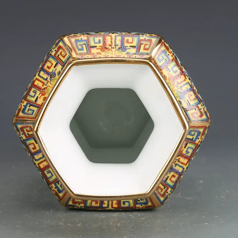 Hexagonal porcelain vase with intricate multicolored enamel patterns and gold trim from porcelain vase collection