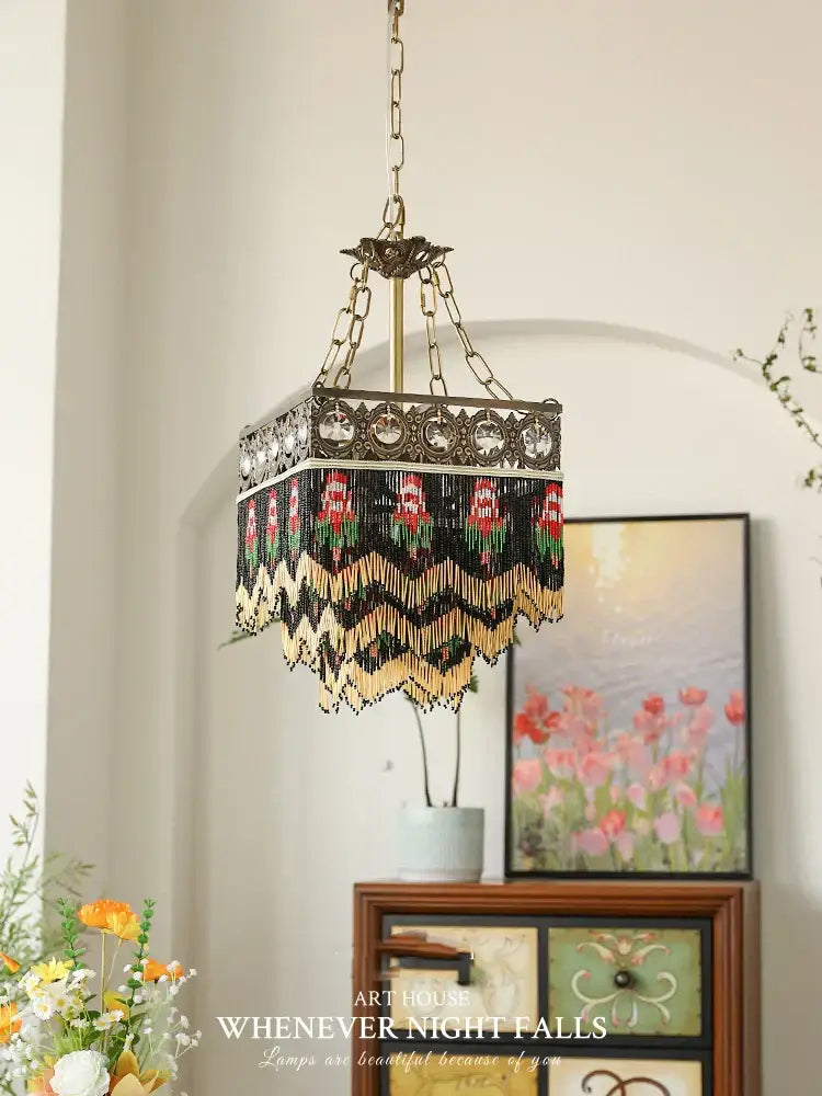 Antique retro black rose tassel pendant lights featuring an intricate brass chandelier with black red and gold beaded fringe