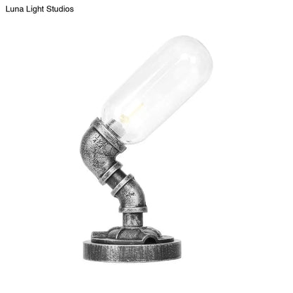 Lámpara de escritorio industrial plateada antigua con pantalla de cristal transparente/ámbar y brazo curvo