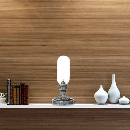 Lámpara de escritorio industrial plateada antigua con pantalla de cristal transparente/ámbar y brazo curvo