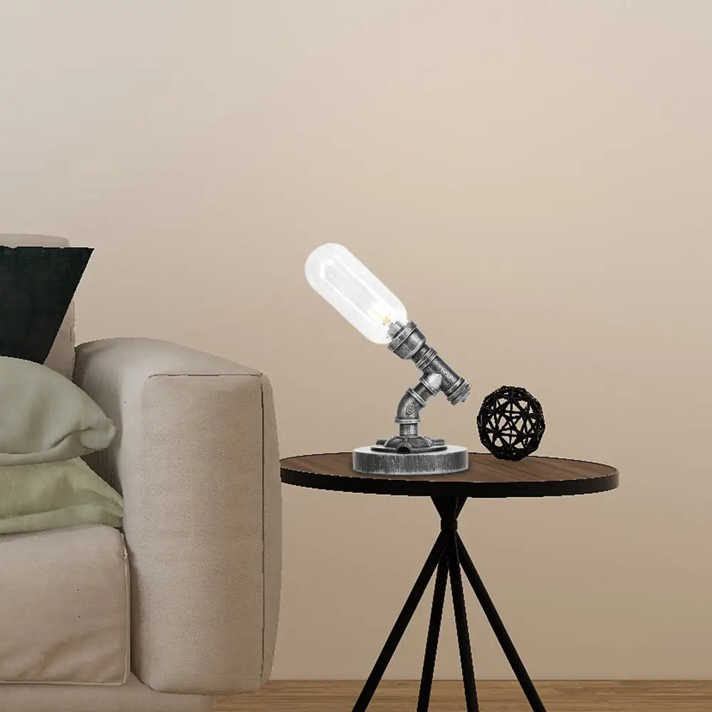 Lámpara de escritorio industrial plateada antigua con pantalla de cristal transparente/ámbar y brazo curvo