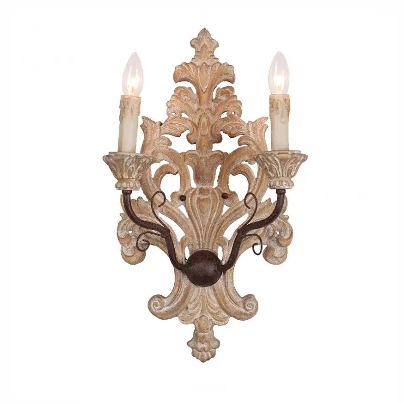 Antique solid wood wall lamp with ornate distressed white wood and dark metal accents decorbites elegant solid sconce