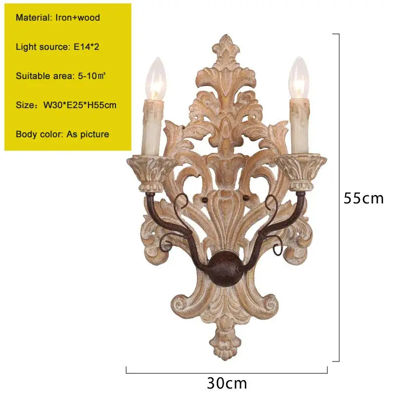 Antique solid wood wall lamp with ornate light-colored carved details and two candle-shaped bulbs for elegant decorbites decor