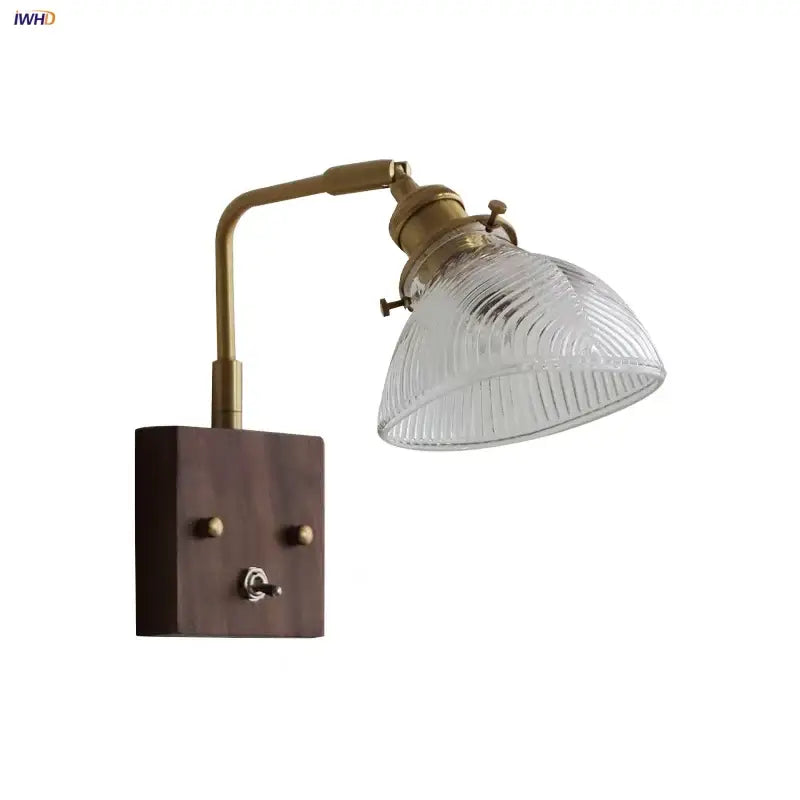 Antique walnut and brass wall light with clear glass ribbed shade and dark wood mount by decorbites clear glass