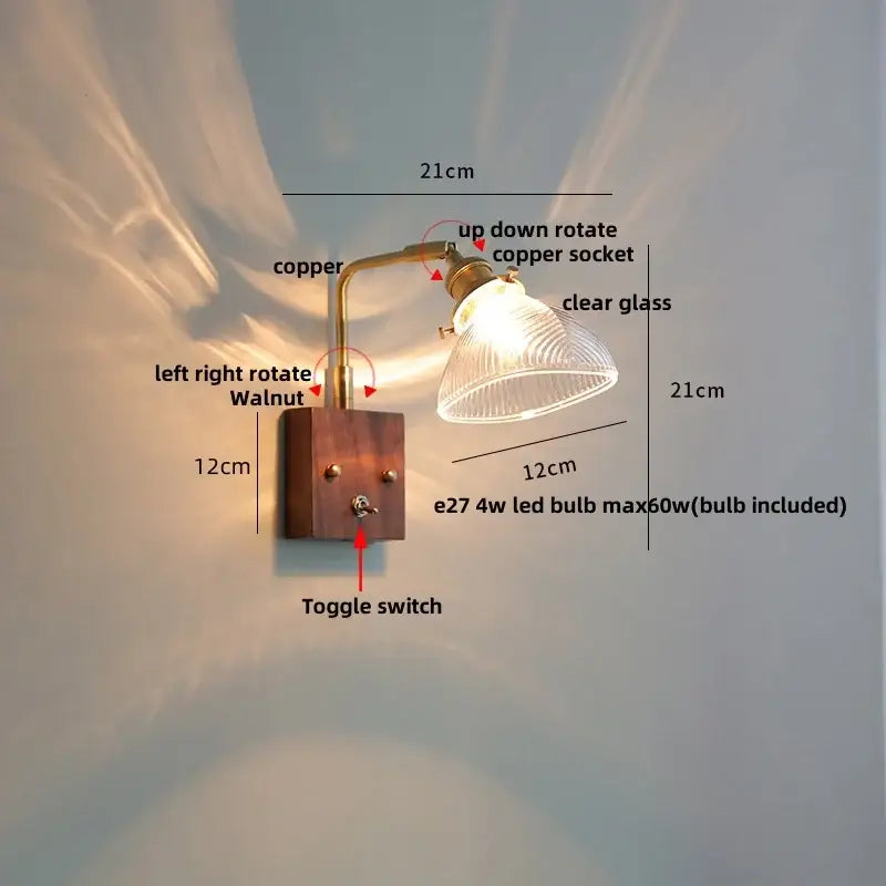 Antique walnut and brass clear glass wall light with copper-finished arm mounted on walnut wood base by decorbites clear glass