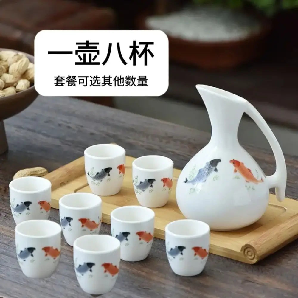 Antique white ceramic warming container set with pitcher and eight cups featuring hand-painted koi fish decorbites ceramic wine