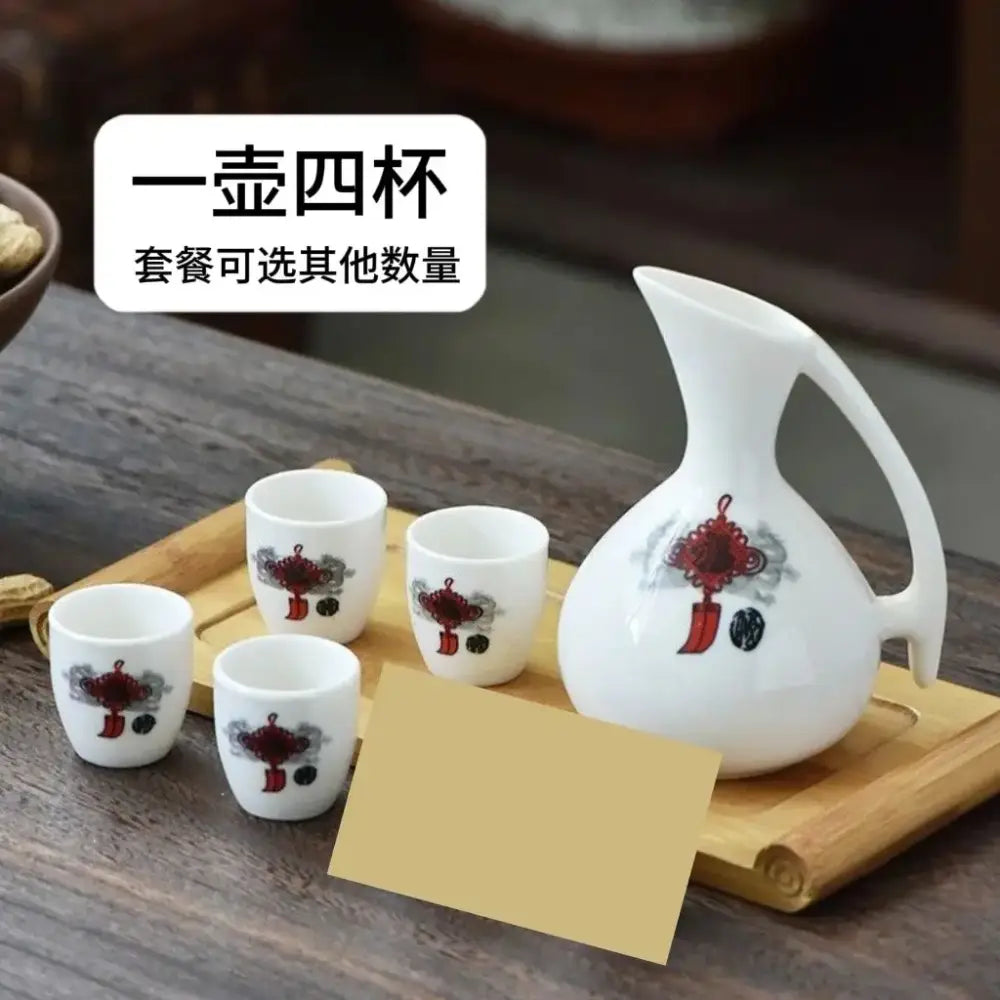 Antique white ceramic warming container set featuring a pitcher and four cups with red chinese knot decorbites ceramic wine design