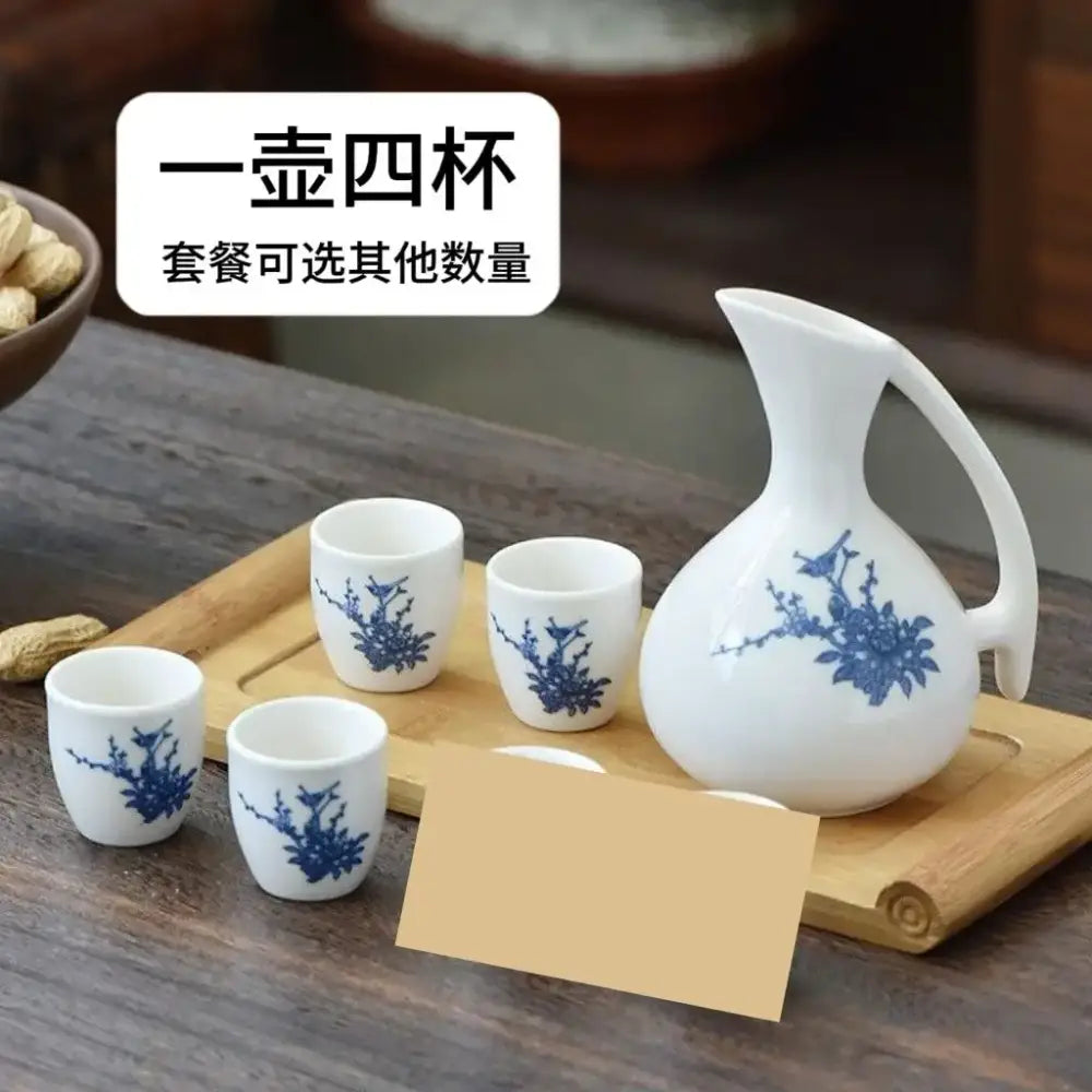 Antique white ceramic warming container dining set with blue cherry blossom pattern includes pitcher and four cups