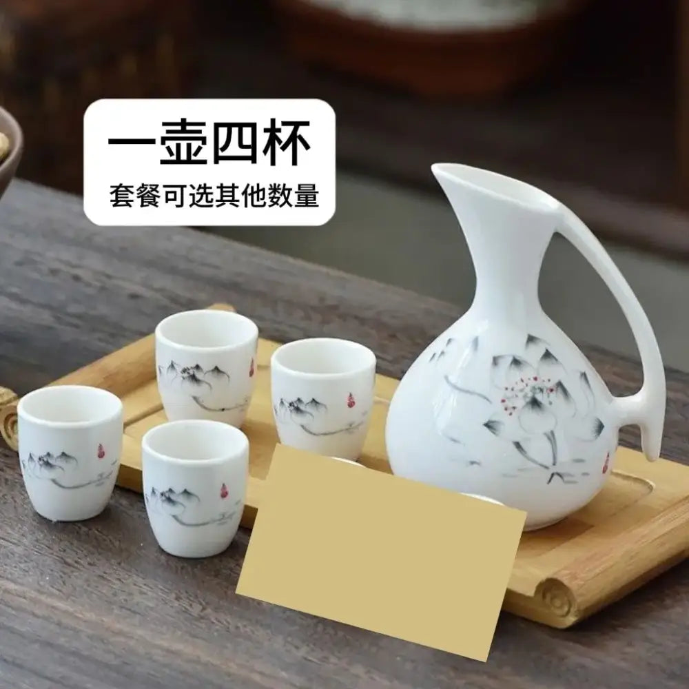 Antique white ceramic warming container set with black and red lotus flower design and four matching cups decorbites ceramic wine