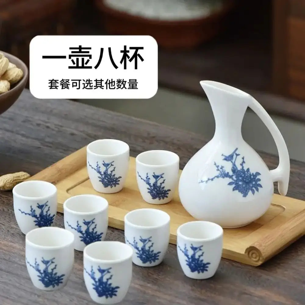 Antique white ceramic warming container dining room set with blue floral patterns featuring one pitcher and eight cups