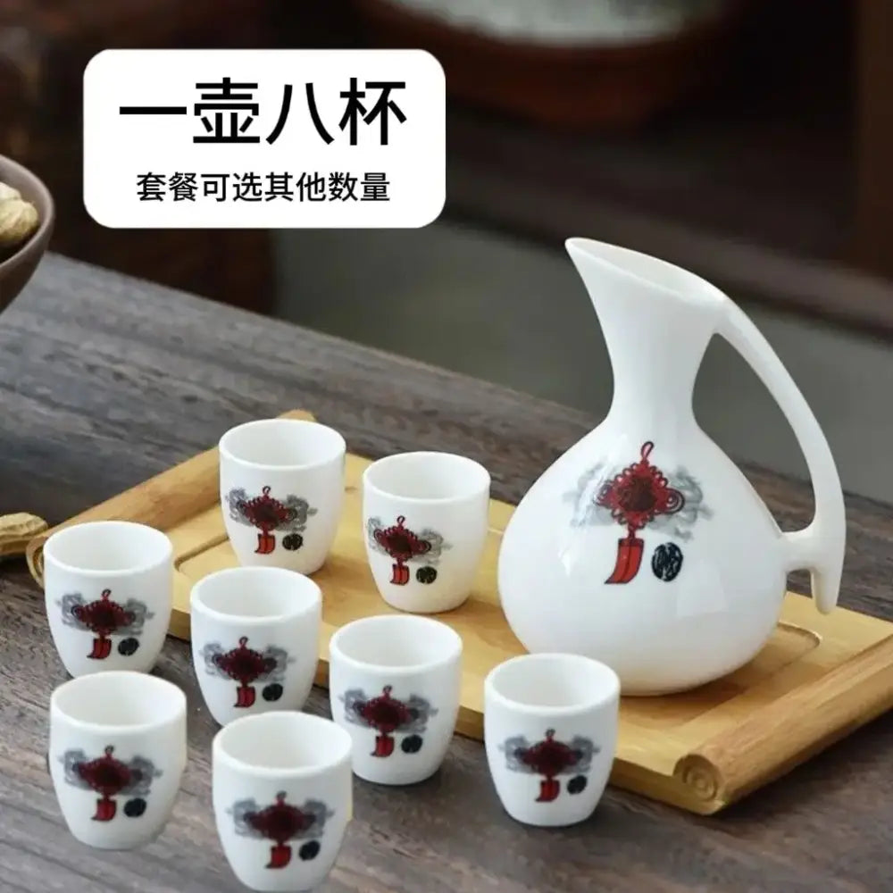 Antique white ceramic warming container with red and gray cherry blossom motifs and eight matching cups by decorbites ceramic wine
