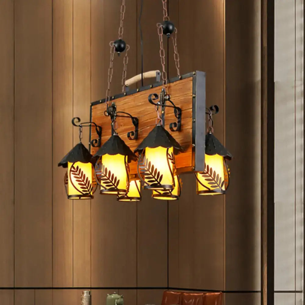 DecorBites™ antique white dining room chandelier with metal arms and four warm-lit clear glass shades featuring leaf cutouts