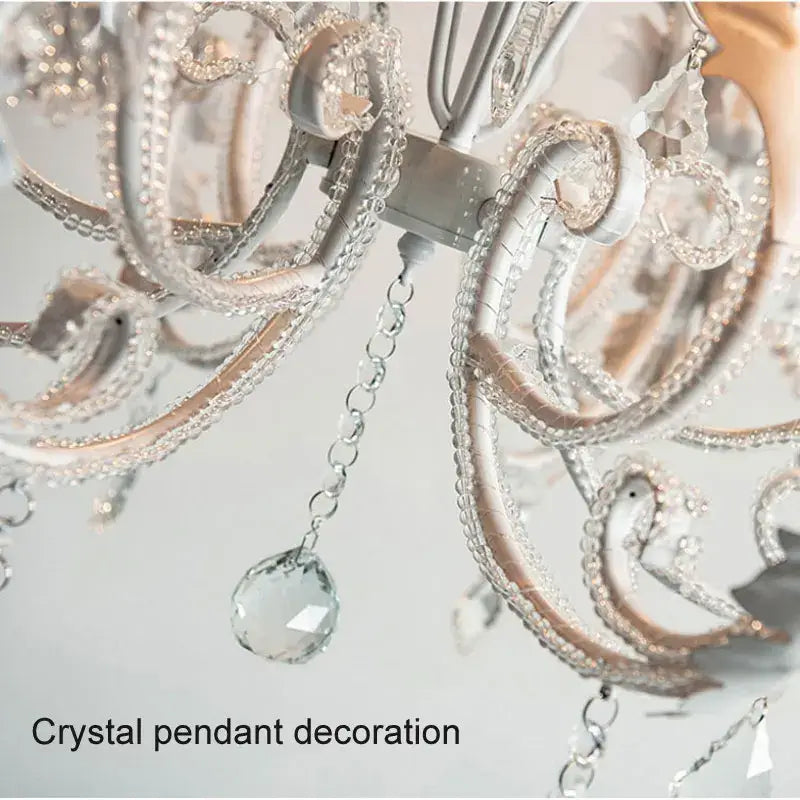 Elegant antique white decorbites iron crystal chandelier with intricate silver-toned metalwork and clear crystal pendants