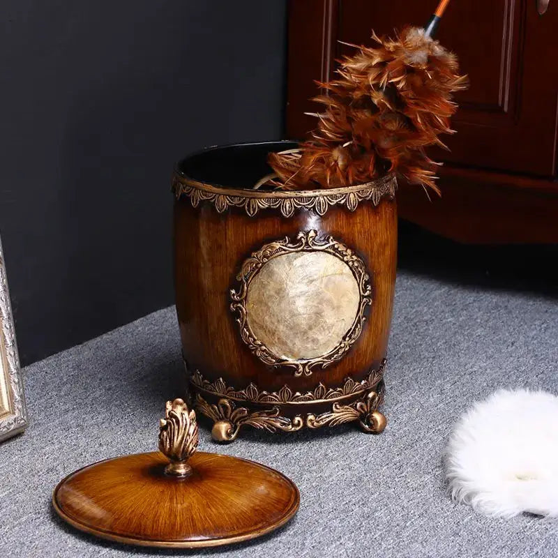Antique wood and gold covered trash can with ornate metal accents and marble inset for decorbites living room decor