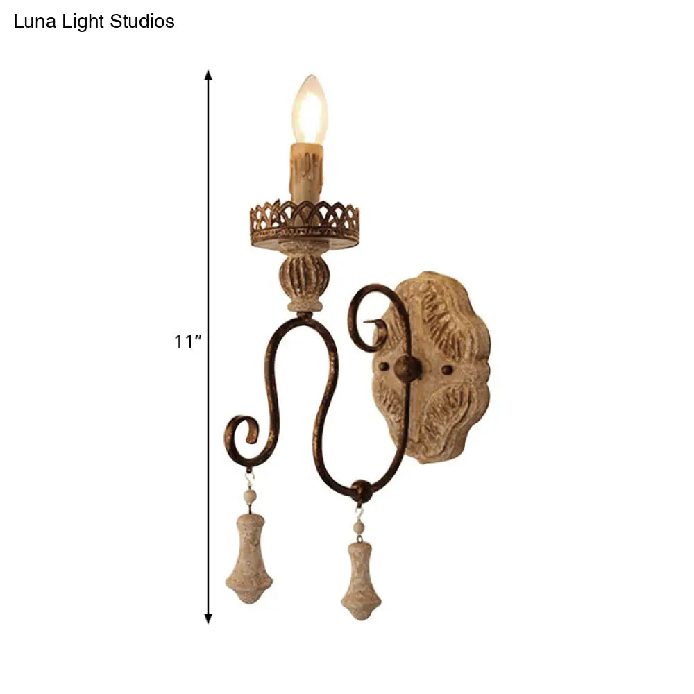 Lámpara de pared estilo vela en bronce envejecido: perfecta para la iluminación del dormitorio