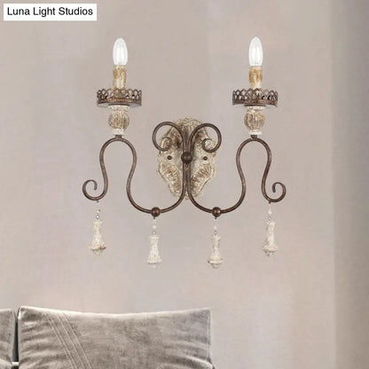 Lámpara de pared estilo vela en bronce envejecido: perfecta para la iluminación del dormitorio