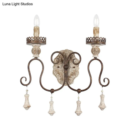 Lámpara de pared estilo vela en bronce envejecido: perfecta para la iluminación del dormitorio