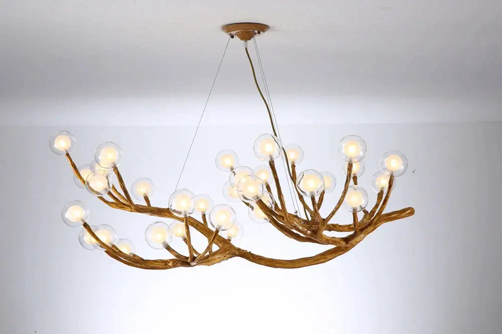 Bronze-colored antler style pendant light with branching arms and clear glass bubble led bulbs for dining room decorbites glass bubble