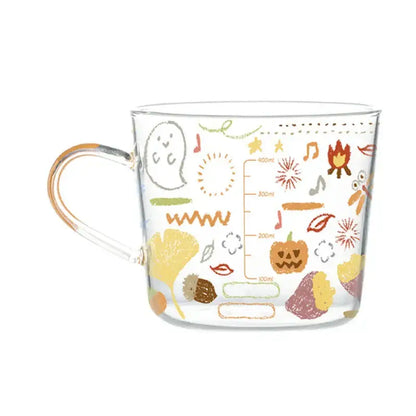 Clear glass 500ml glass mug with apricot and orange autumn pattern featuring pumpkins leaves and musical notes
