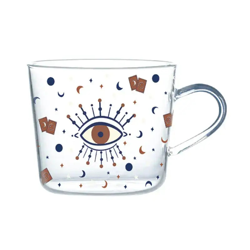 Clear 500ml glass mug with apricot and orange pattern featuring central eye and celestial motifs in navy blue and copper