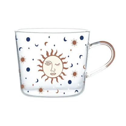 Clear 500ml glass mug with apricot and orange celestial pattern featuring sun face and stars for kitchen breakfast use