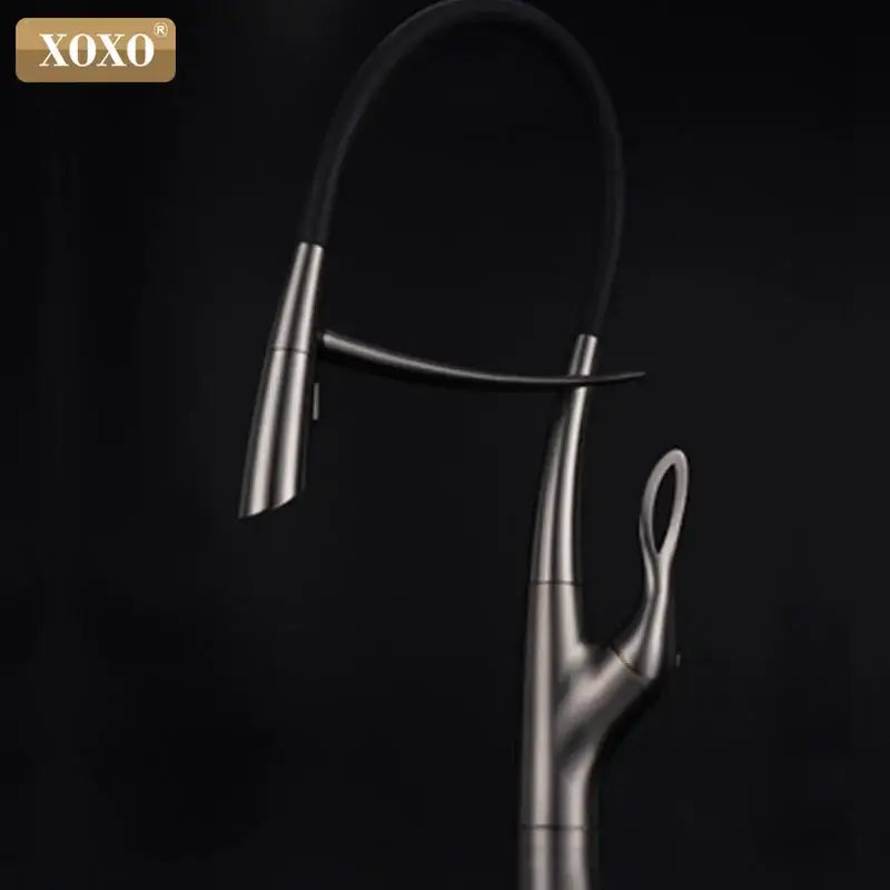 Arched brushed nickel kitchen faucet with a sleek curved spout and black rubberized flexible hose by decorbites
