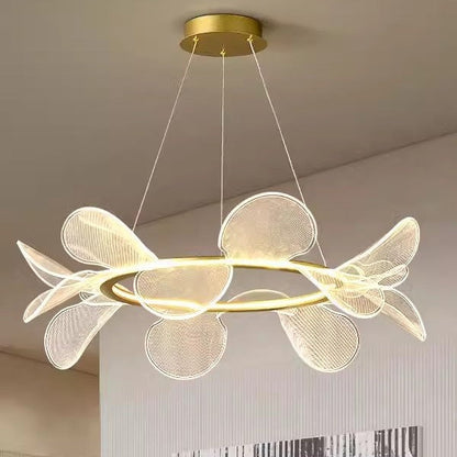 Gold and white modern chandelier with petal-like design, likely from a contemporary lighting brand.