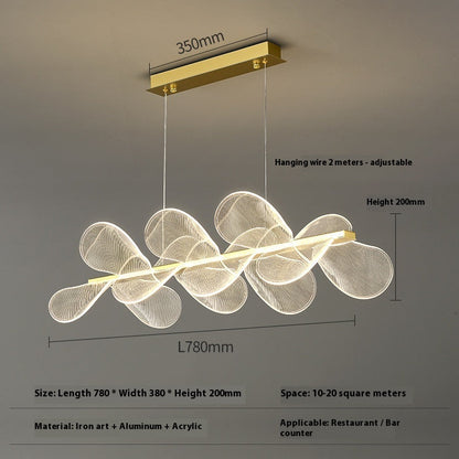 Modern gold-accented pendant light with white wire mesh design and acrylic elements, suitable for restaurant or bar counter spaces.