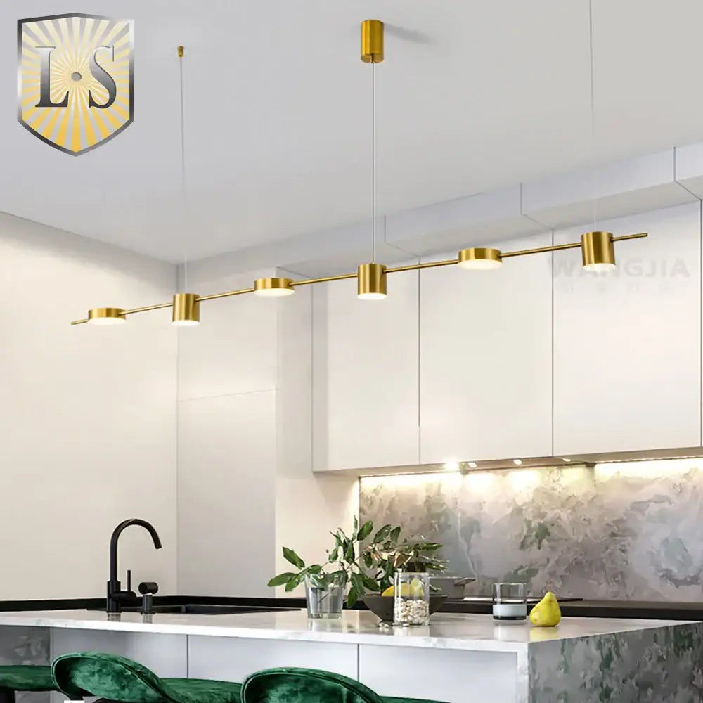 Gold-finished art deco pendant light with cylindrical fixtures and sleek design for dining room light sources